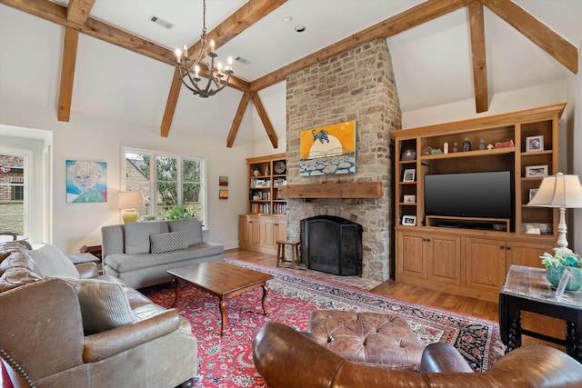 living room with a fireplace, light hardwood / wood-style flooring, lofted ceiling with beams, and a notable chandelier