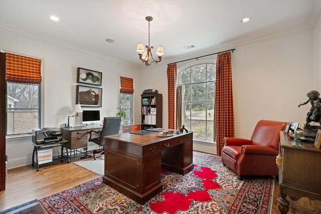 office area with a healthy amount of sunlight and ornamental molding