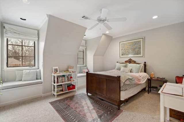 carpeted bedroom featuring ceiling fan and crown molding