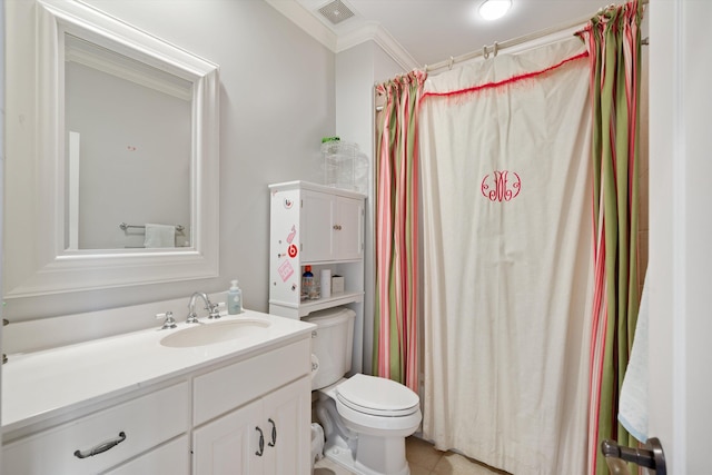 bathroom featuring toilet, ornamental molding, and vanity