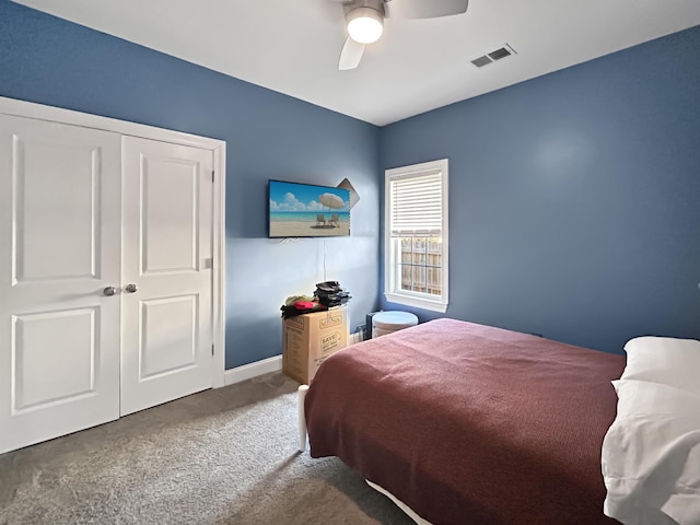 carpeted bedroom featuring a closet and ceiling fan