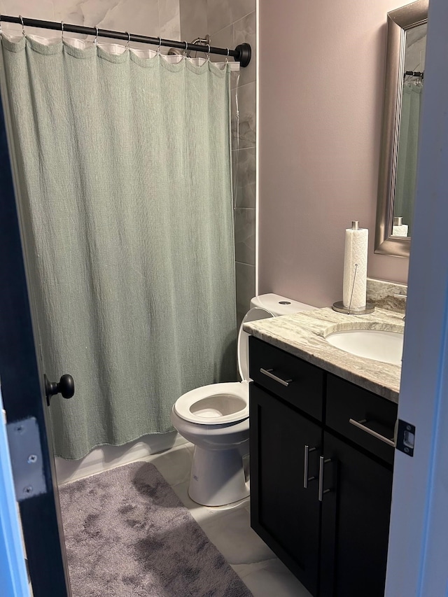 bathroom featuring toilet, a shower with curtain, and vanity