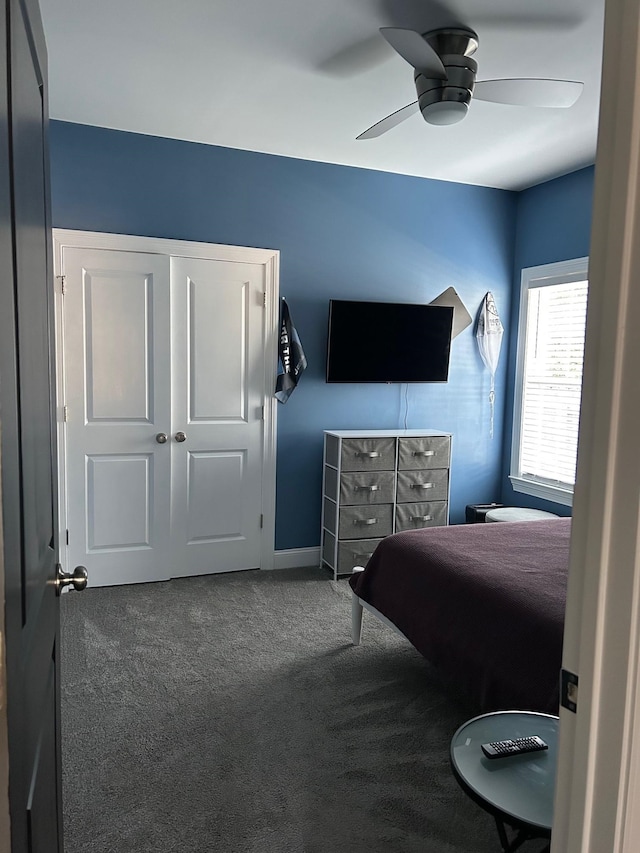 bedroom with ceiling fan and carpet floors