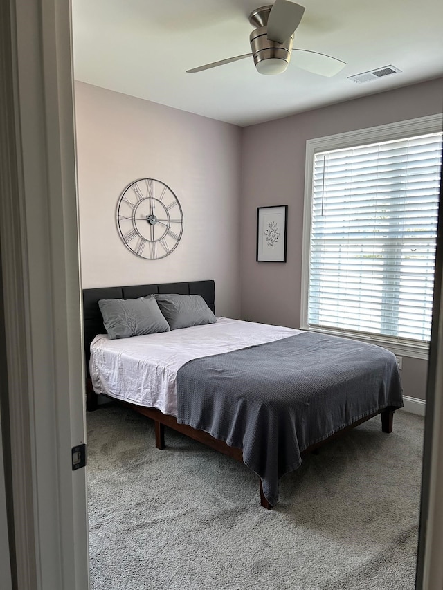 carpeted bedroom with ceiling fan