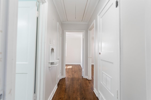 hallway featuring dark hardwood / wood-style floors and ornamental molding