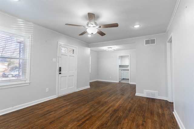 interior space with ceiling fan, ornamental molding, and dark hardwood / wood-style floors