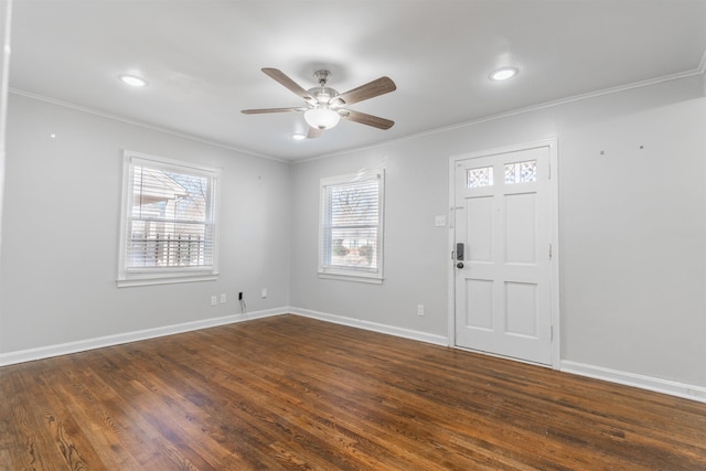 entrance foyer with ceiling fan, dark hardwood / wood-style flooring, and ornamental molding