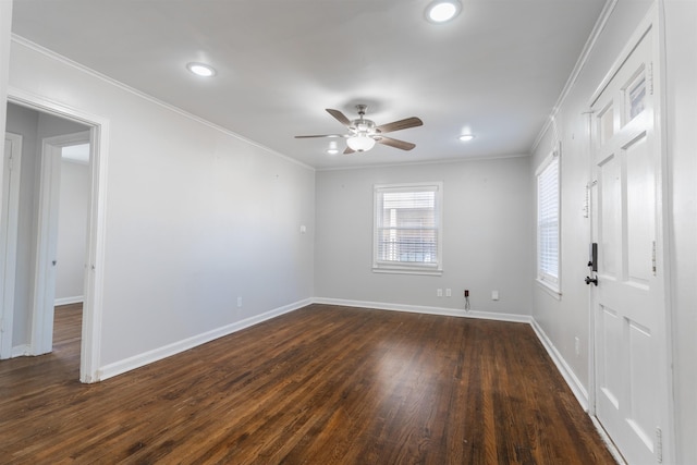 empty room featuring ceiling fan, dark hardwood / wood-style flooring, and crown molding