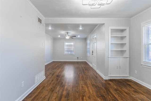 interior space with ceiling fan, crown molding, built in features, and dark hardwood / wood-style floors