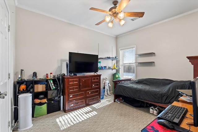 bedroom featuring ceiling fan, crown molding, and light colored carpet