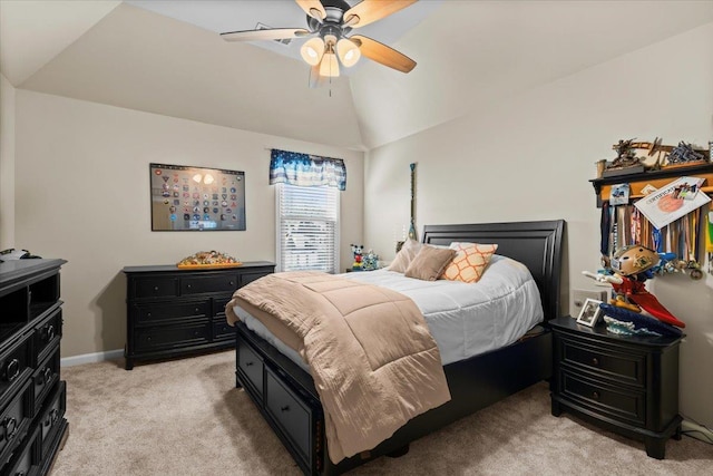 bedroom with ceiling fan, light carpet, and vaulted ceiling