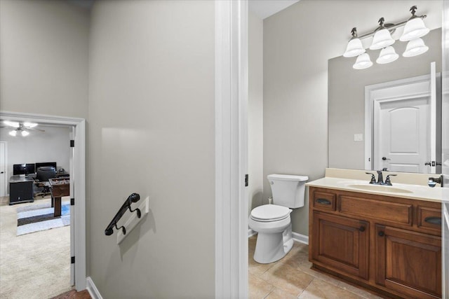 bathroom with toilet and vanity