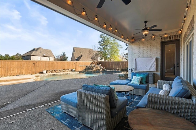 view of patio with pool water feature, ceiling fan, an outdoor living space, and a fenced in pool