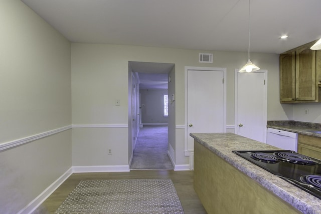 kitchen featuring white dishwasher, decorative light fixtures, dark hardwood / wood-style flooring, and black electric cooktop