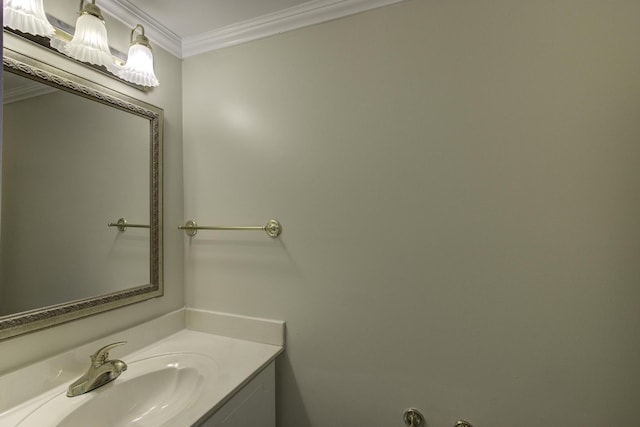 bathroom with ornamental molding and vanity