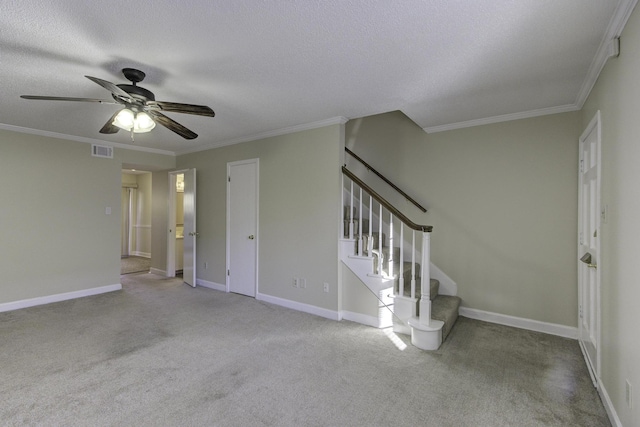 interior space with ceiling fan, light carpet, and ornamental molding