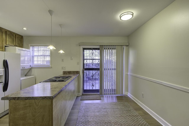 kitchen with light wood-type flooring, black electric stovetop, white refrigerator with ice dispenser, and decorative light fixtures