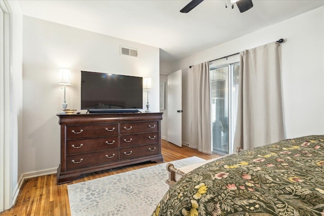 bedroom with ceiling fan and light hardwood / wood-style floors