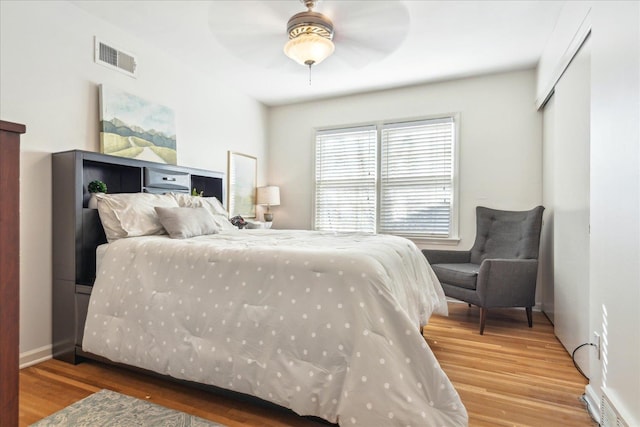 bedroom featuring ceiling fan and wood-type flooring