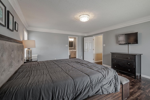 bedroom with a textured ceiling, dark hardwood / wood-style floors, ornamental molding, and ensuite bath