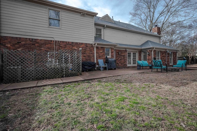 back of house featuring a patio