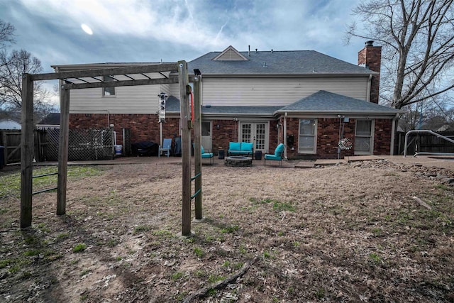 rear view of house featuring outdoor lounge area and a pergola