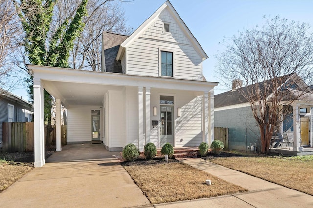 view of front of property featuring a carport