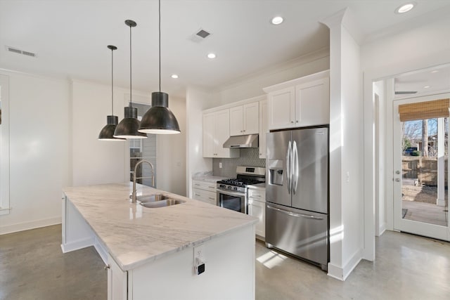 kitchen featuring pendant lighting, white cabinetry, stainless steel appliances, sink, and a kitchen island with sink