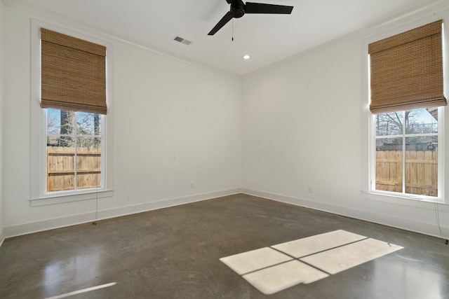 empty room featuring ceiling fan and ornamental molding