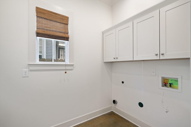 clothes washing area with washer hookup, cabinets, and electric dryer hookup