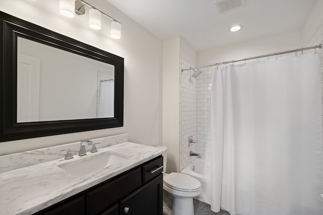 full bathroom with toilet, vanity, and shower / bath combo with shower curtain