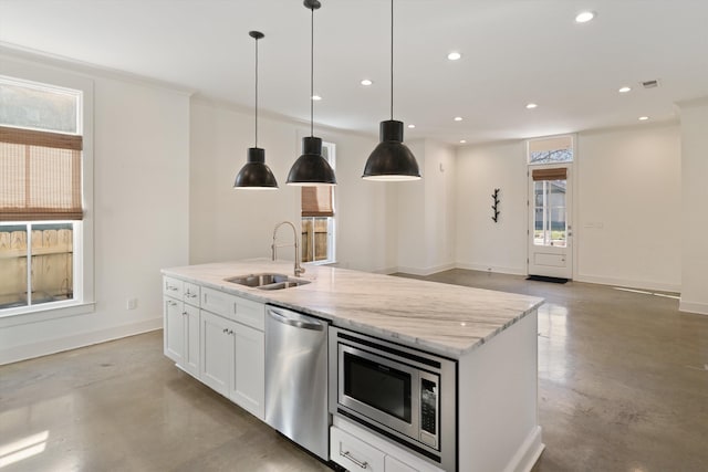 kitchen with concrete flooring, stainless steel appliances, white cabinetry, and sink