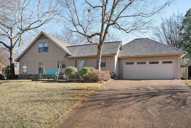 view of front facade with a front lawn and a garage