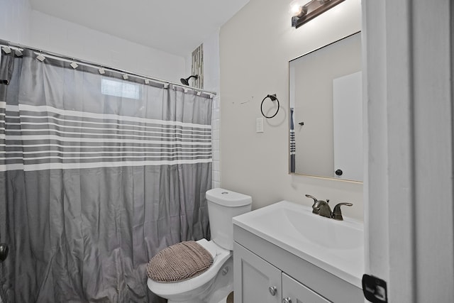 bathroom with toilet and vanity