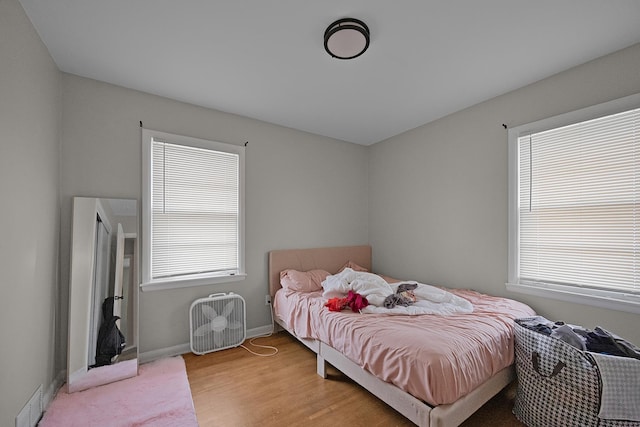 bedroom with light hardwood / wood-style flooring