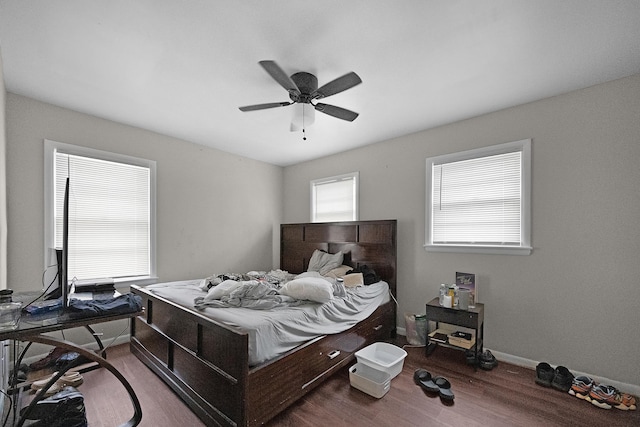 bedroom with ceiling fan and wood-type flooring