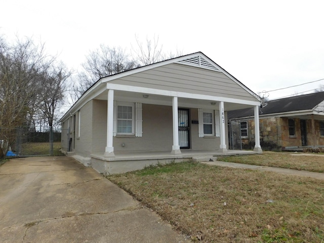 bungalow featuring a front yard and a porch