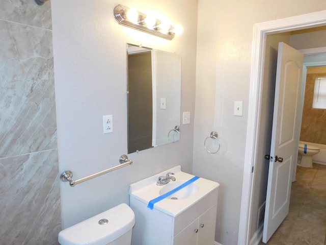 bathroom with tile patterned floors, toilet, and vanity