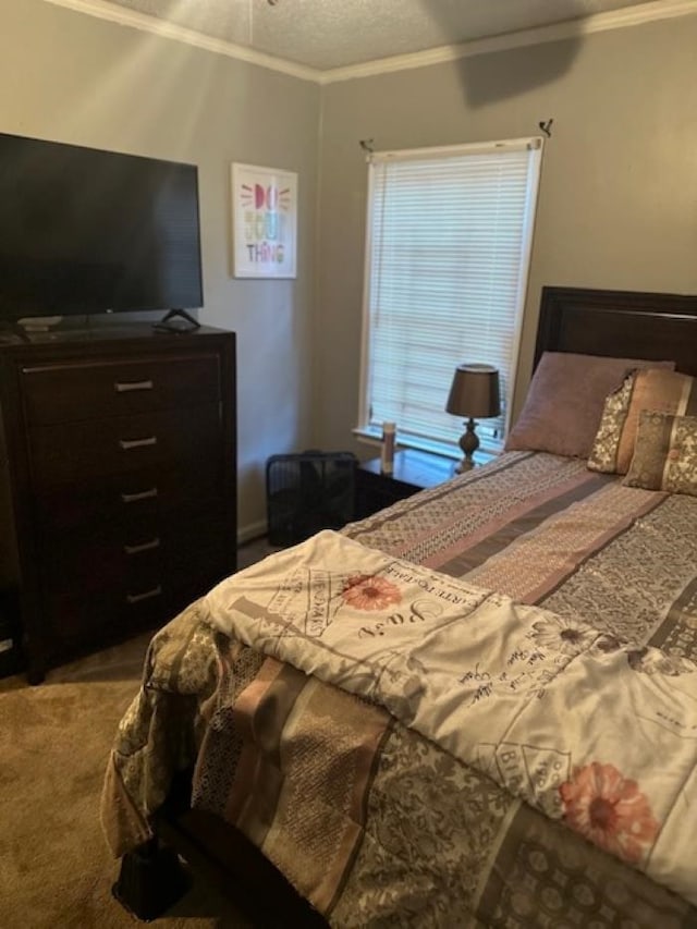 bedroom featuring a textured ceiling, carpet, and crown molding