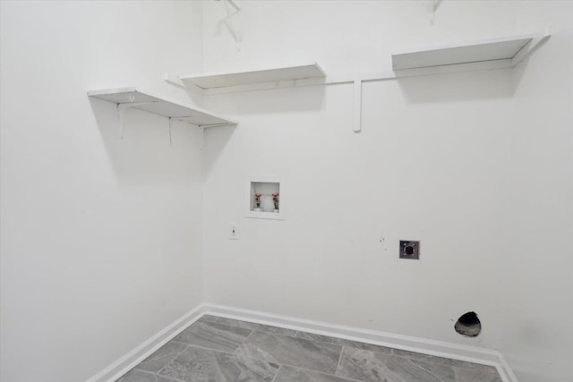 laundry area with laundry area, hookup for a washing machine, baseboards, and electric dryer hookup