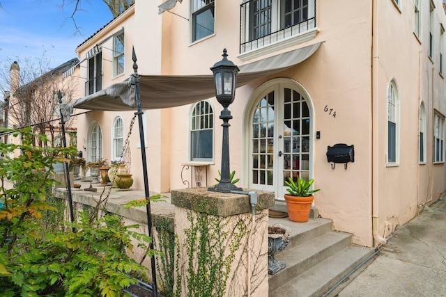 entrance to property featuring french doors