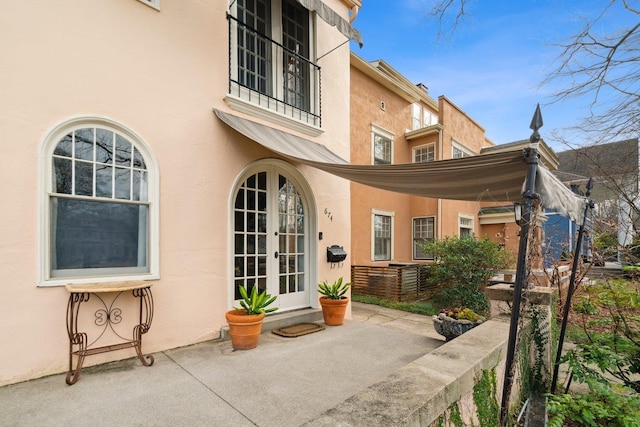 rear view of house featuring french doors and a patio