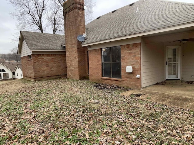 back of property with a patio