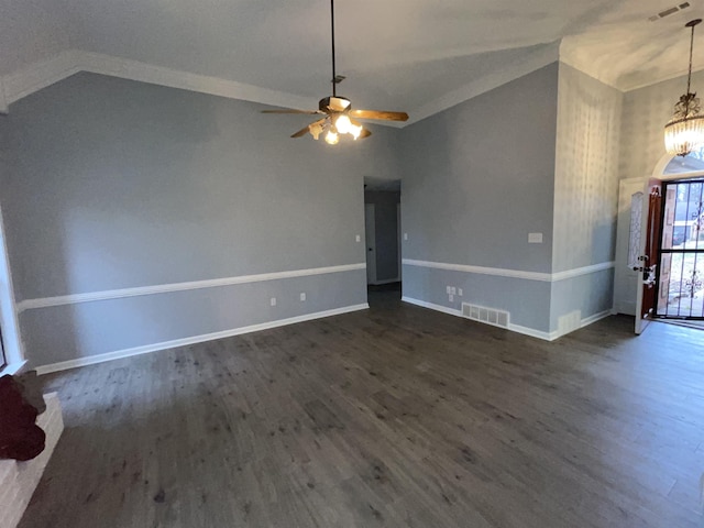 interior space with lofted ceiling, ceiling fan with notable chandelier, and dark hardwood / wood-style floors