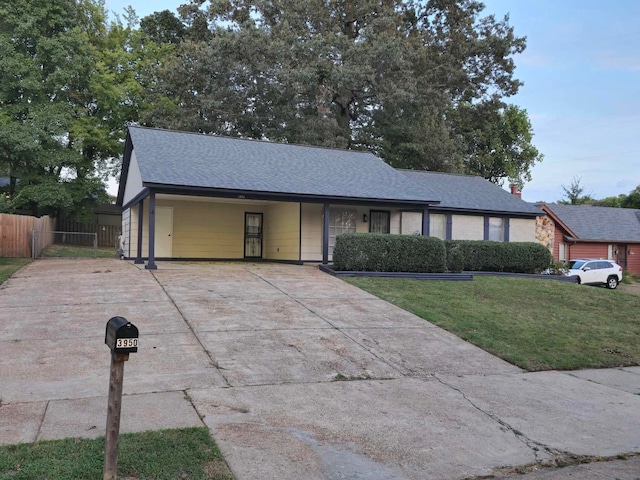 single story home featuring a front yard and a carport