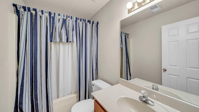 full bathroom with a textured ceiling, toilet, shower / tub combo, and vanity