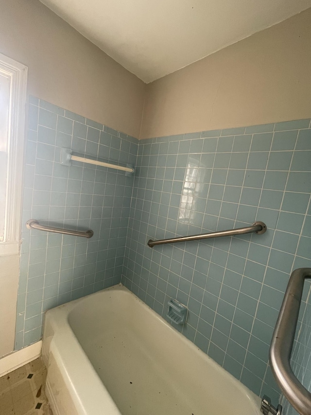 bathroom featuring a tub to relax in