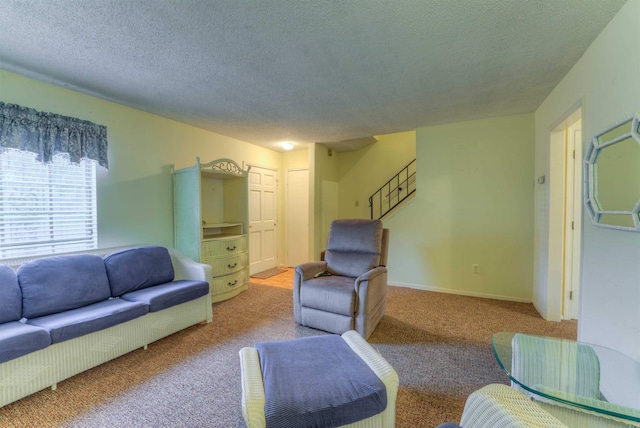 living room featuring a textured ceiling and light carpet