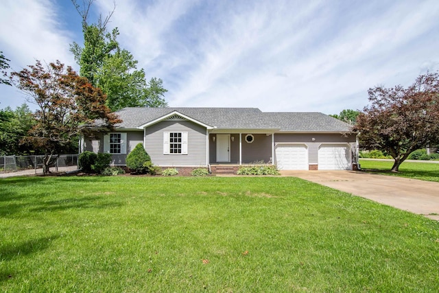 ranch-style home featuring a front yard and a garage