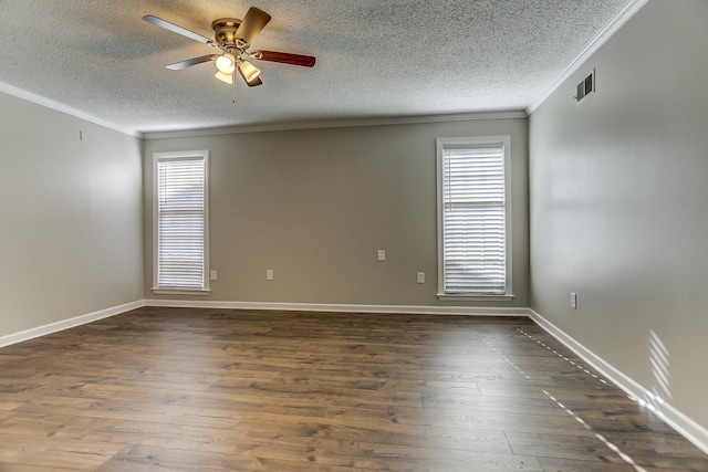 unfurnished room featuring ceiling fan, dark wood-type flooring, a textured ceiling, and ornamental molding